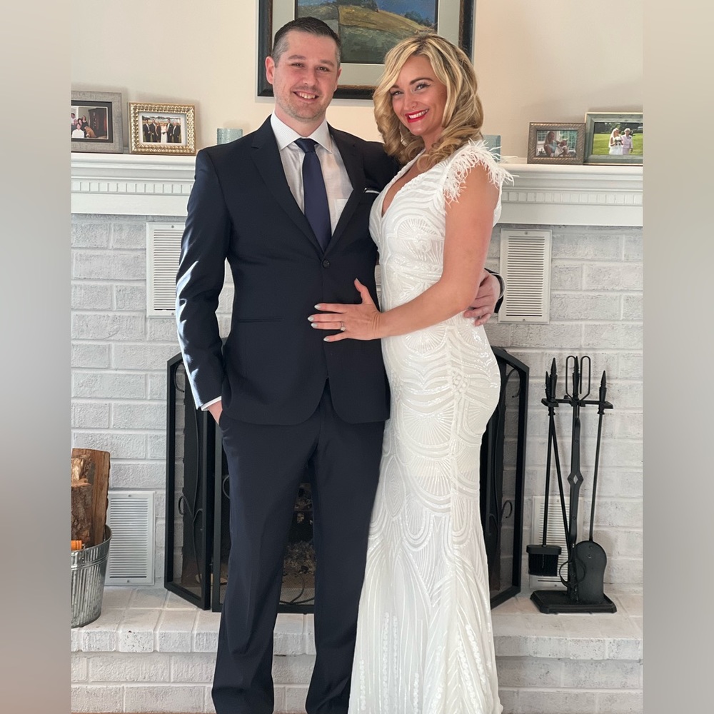 Fashion Nova high end - gorgeous white sparkly feathered at the sleeves.